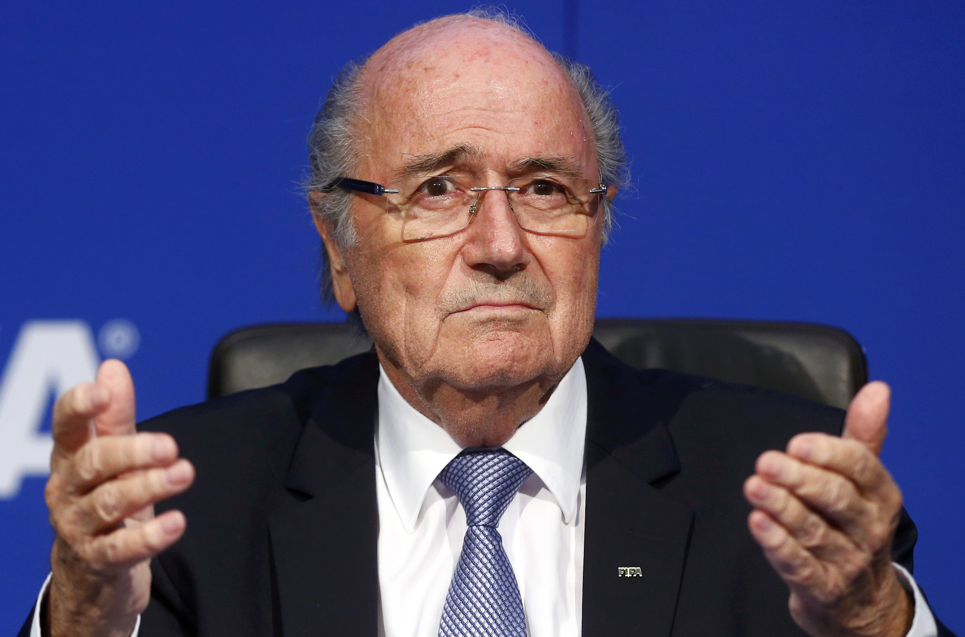 FIFA President Sepp Blatter reacts during a news conference after the Extraordinary FIFA Executive Committee Meeting at the FIFA headquarters in Zurich, Switzerland July 20, 2015. World football's troubled governing body FIFA will vote for a new president, to replace Sepp Blatter, at a special congress to be held on February 26 in Zurich, the organisation said on Monday. REUTERS/Arnd Wiegmann