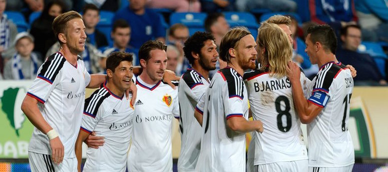 epa04865548 Davide Calla (2-L) of FC Basel celebrates with team mates after scoring a goal during the UEFA Champions League third qualifying round first leg soccer match between Lech Poznan and FC Basel in Poznan, Poland, 29 July 2015. EPA/Jakub Kaczmarczyk POLAND OUT