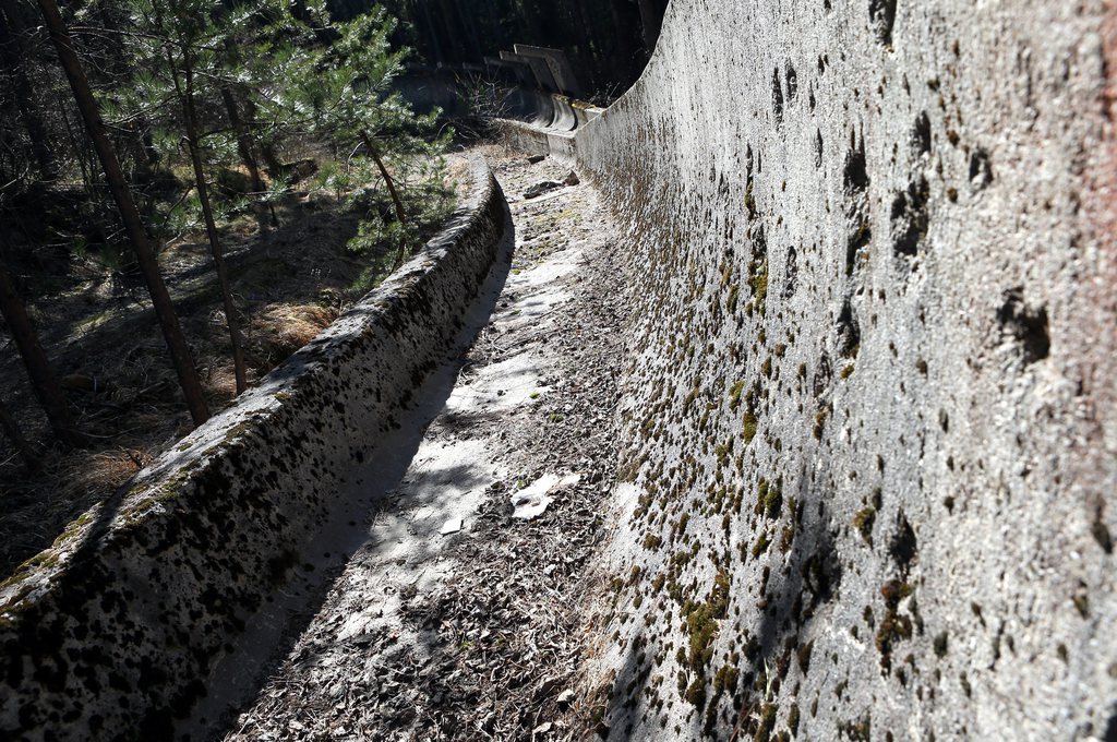 epa04143131 Moss covers a bobsled track in Mount Trebevic near Sarajevo which was used for competitions during the XIV Winter Olympic Games, in Sarajevo, Bosnia and Herzegovina, 16 March 2014. Thirty years ago, Sarajevo hosted the Winter Games in 1984, eight years later it was shelled as Bosnia sank into the war spreading through the crumbling Yugoslav federation. Everything that was not set in concrete was carried away. The bobsled track, reachable only via unkempt forest paths, is falling prey to the vegetation. Despite investment offers and complete facilities donated from Switzerland, nobody has stepped in to restore the ski lifts on Mount Trebevic, not to mention the deteriorating ski-jumping hill. EPA/FEHIM DEMIR