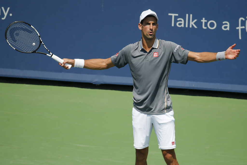 Novak Djokovic, of Serbia, reacts during a final match against Roger Federer, of Switzerland, at the Western & Southern Open tennis tournament, Sunday, Aug. 23, 2015, in Mason, Ohio. (AP Photo/John Minchillo)