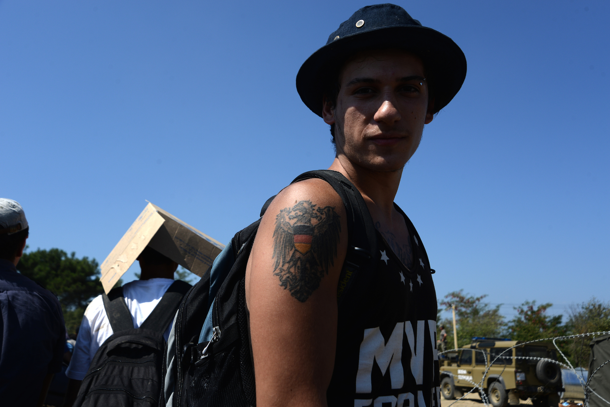 Deutschland als Tattoo und Mekka f¸r Syrer // Soldiers, Police and Refugees at Eidomeni on the Greek border to FYR Macedonia The train railroad is a atypical borderstation for refugees. Other people are not allowed to pass. In Eidomeni/Gevgelija on September 1. 2015