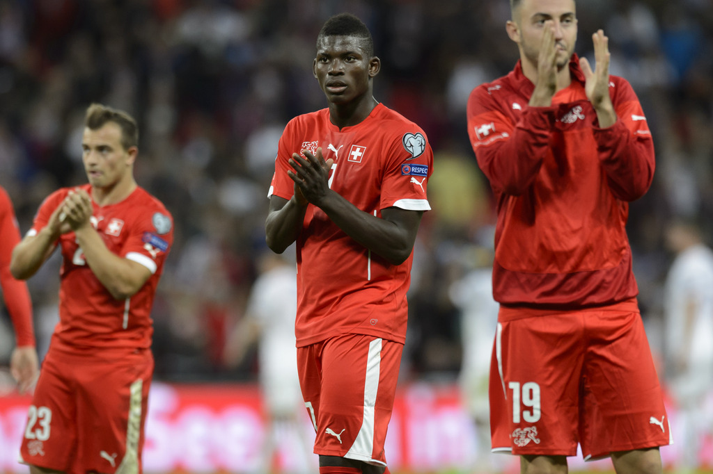 From left, Swiss forward Xherdan Shaqiri, Swiss forward Breel Embolo and Swiss midfielder Josip Drmic look desapointed after loosing the UEFA EURO 2016 qualifying group E soccer match England against Switzerland, at the Wembley Stadium, London, Tuesday, September 8, 2015. (KEYSTONE/Laurent Gillieron)