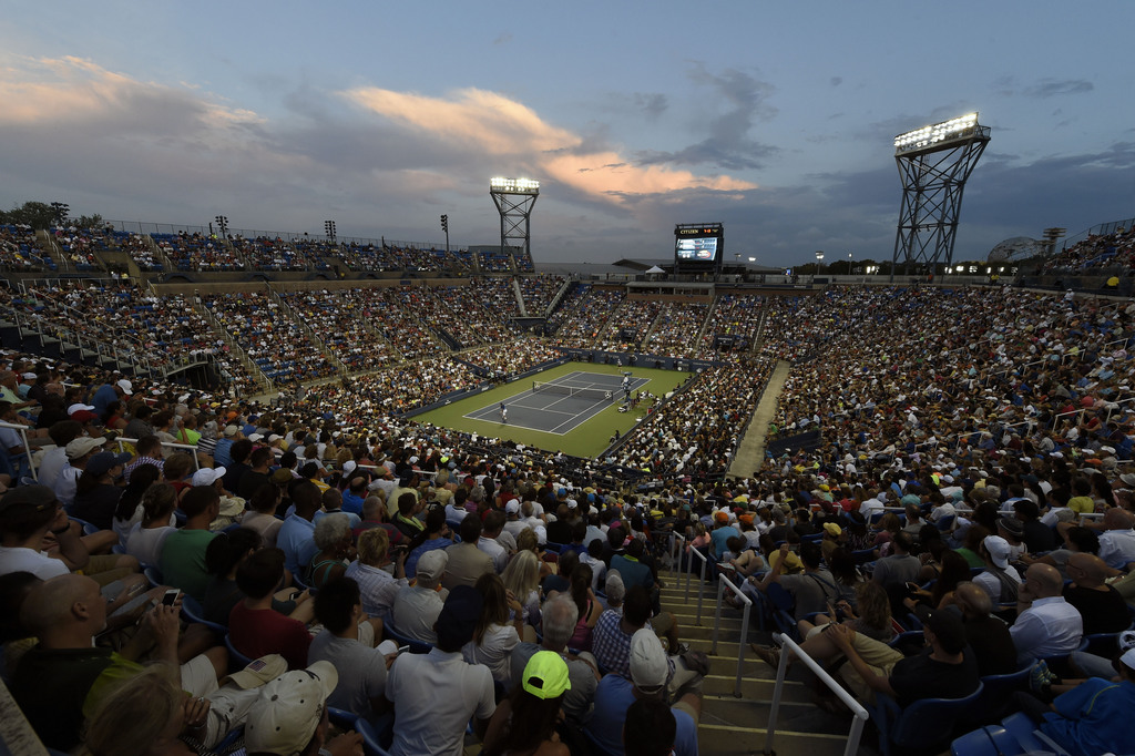 Spectators watch a quarterfinal match between Stan Wawrinka, of Switzerland, and Kevin Anderson, of South Africa, at the U.S. Open tennis tournament, Wednesday, Sept. 9, 2015, in New York. (AP Photo/Kathy Kmonicek)