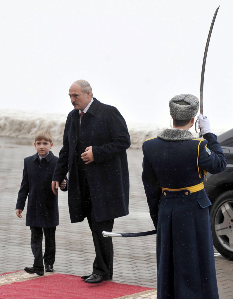 epa02541743 Belarus President Alexander Lukashenko (C) and his son Nikolay 'Kolya' Lukashenko (L) arrive to attend his swearing-in ceremony at the Palace of the Republic in Minsk, Belarus, 21 January 2011. Lukashenko was sworn in for a fourth term, facing total isolation by the West over a crackdown on the Belarus opposition after his disputed election victory. EPA/VIKTOR DRACHEV / POOL