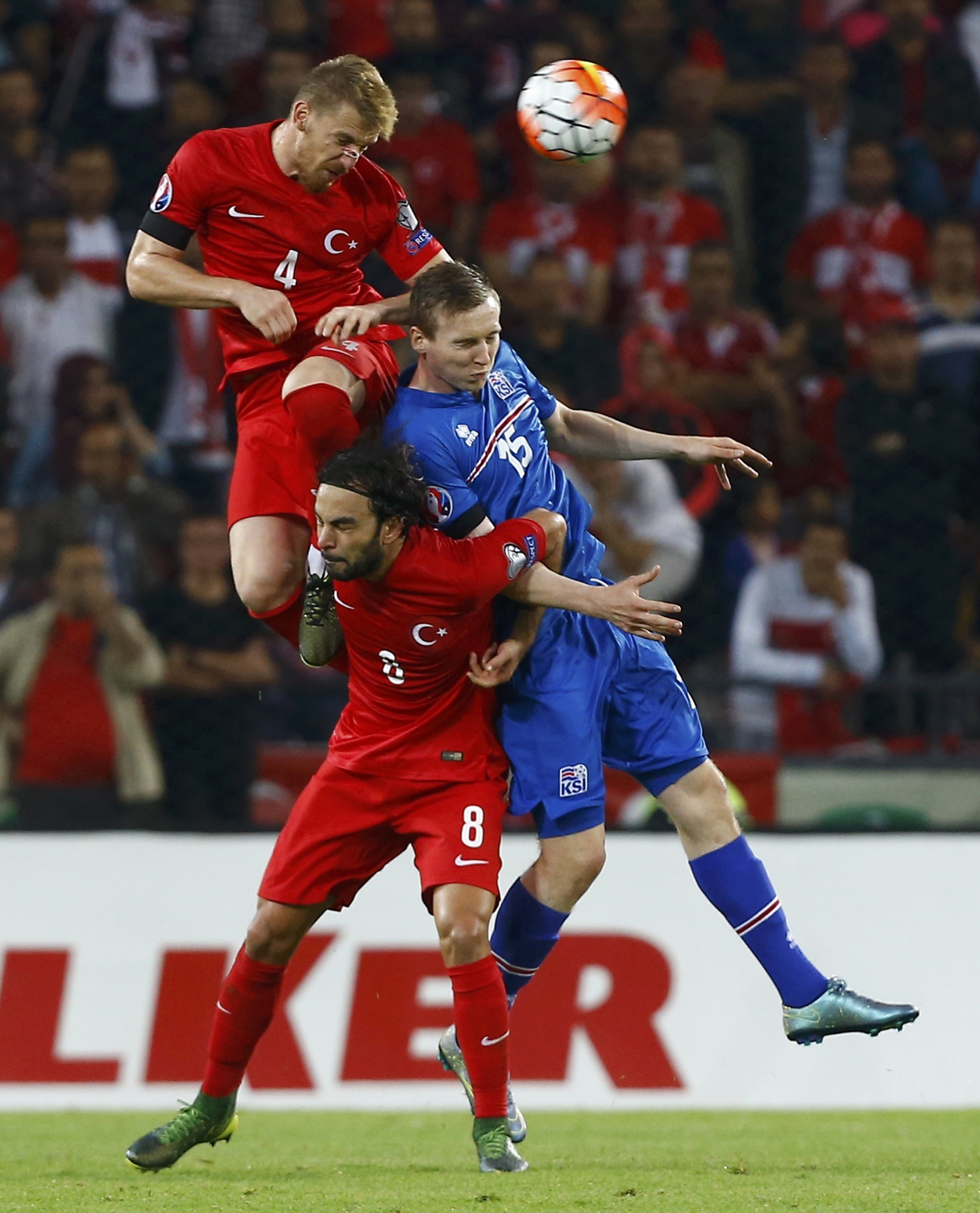 <p>Turkey's Serdar Aziz (L) heads the ball against Iceland's Jon Daoi Bodvarsson (R) and team mate Selcuk Inan during their Euro 2016 Group A qualification soccer match in Konya, Turkey, October 13, 2015. REUTERS/Umit Bektas</p>