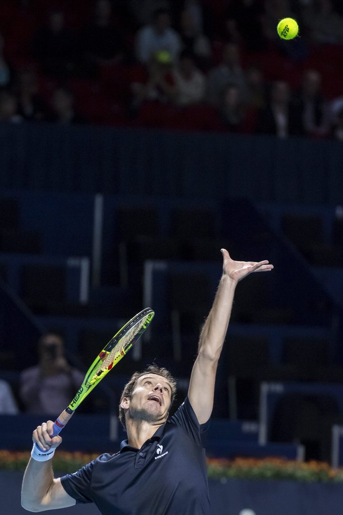 epa05003630 France's Richard Gasquet in action against Croatia's Ivo Karlovic during their quarter final match for the Swiss Indoors tennis tournament at the St. Jakobshalle in Basel, Switzerland, 30 October 2015. EPA/ALEXANDRA WEY