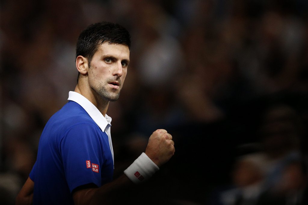 epa05016881 Novak Djokovic of Serbia celebrates winning a point against Andy Murray of Great Britain during the final match at the BNP Paribas 2015 Masters tennis tournament in Paris, France, 08 November 2015. EPA/YOAN VALAT
