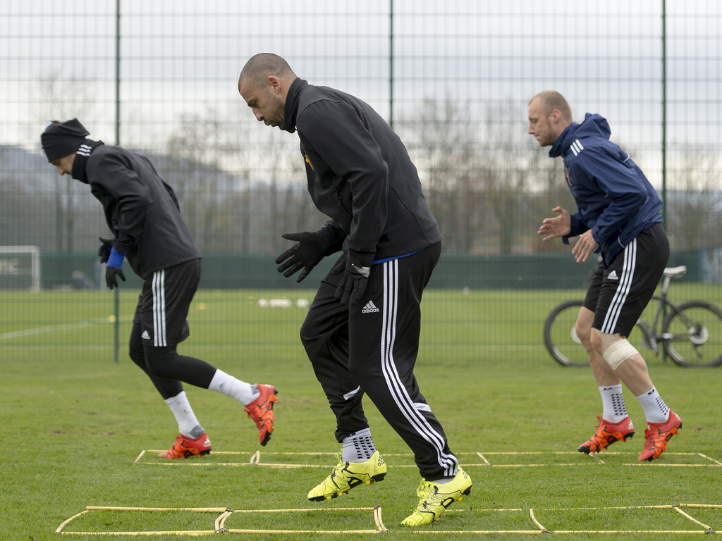 Zdravko Kuzmanovic, Walter Samuel, and Ivan Ivanov, from left, of Switzerland's soccer team FC Basel attend a training session in the St. Jakob-Park training area in Basel, Switzerland, on Wednesday, Nov.25, 2015. Switzerland's FC Basel is scheduled to play against Italy's ACF Fiorentina in an Europa League group I soccer match on Thursday. (Georgios Kefalas/Keystone via AP)