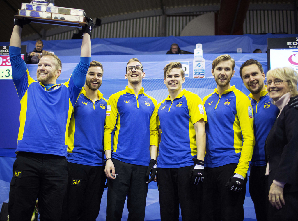Sweden's gold medal team celebrate their win, with from left, Niklas Edin (Skip), Oskar Eriksson (Vice Skip), Kristian Lindstrom, Christoffer Sundgren, Henrik Leeek, Fredrik Lindberg (Coach) reacts after the European Curling Championships men's final Curling match between Sweden and Switzerland in Esbjerg, Denmark, Saturday Nov. 28 2015. (Rune Pedersen/Polfoto via AP) DENMARK OUT