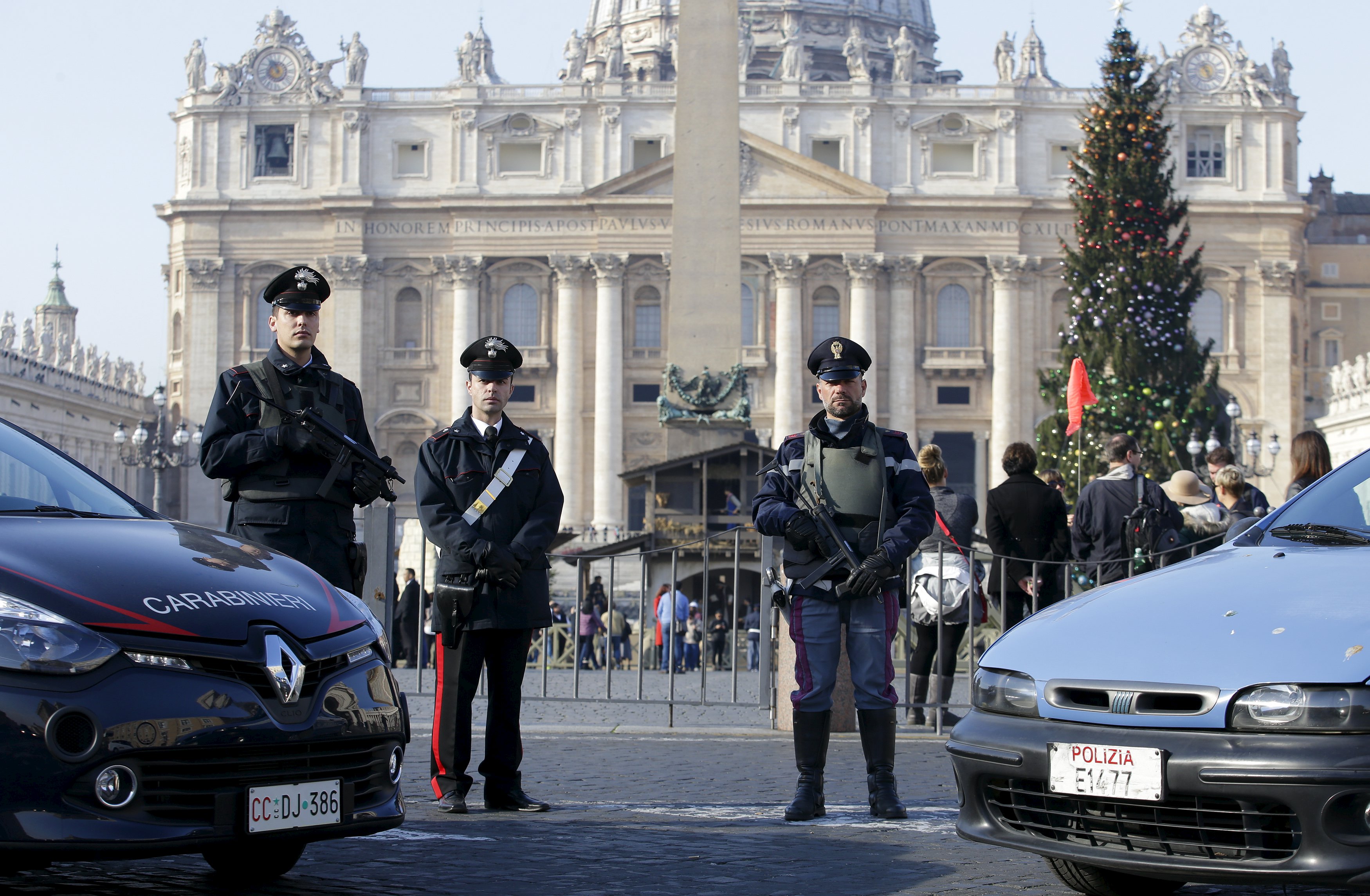 A policeman (R) and Carabinieri patrol in front of the Vatican in Rome, Italy, December 4, 2015. Rome is bracing for the arrival of millions of pilgrims for the Roman Catholic Holy Year which officials had hoped could revitalise the scandal-plagued city, but which threatens to be more of a headache than a help. During the 12-month Jubilee, Catholics coming to the Eternal City can gain indulgences, which, they believe, might speed their passage to heaven. REUTERS/Max Rossi