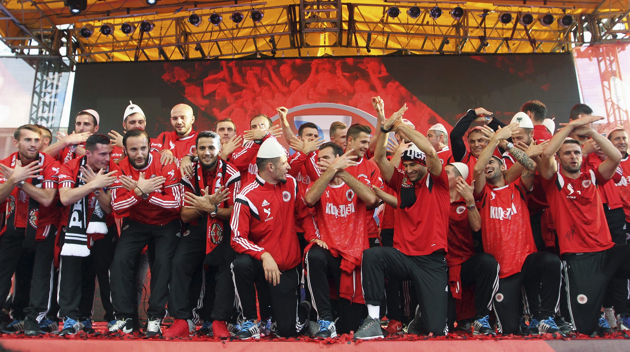 Albanian national soccer players celebrate in Tirana, Albania, October 12, 2015. Albania qualified for Euro 2016, their first ever major tournament, when a 3-0 away win over Armenia clinched second place in Group I above Denmark on Sunday sparking wild celebrations across the country. REUTERS/Arben Celi