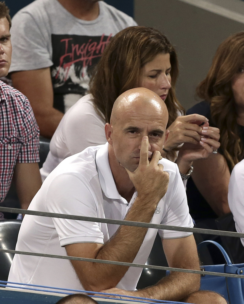Ivan Ljubicic, the coach of Roger Federer of Switzerland, watches Federer play the men's final match against Milos Raonic of Canada during the Brisbane International tennis tournament in Brisbane, Australia, Sunday, Jan. 10, 2016. (AP Photo/Tertius Pickard)