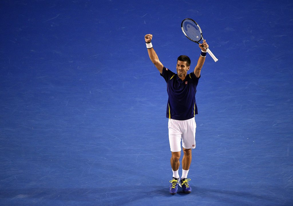 epa05131400 Novak Djokovic of Serbia celebrates his win against Roger Federer of Switzerland during their semi final match on day eleven of the Australian Open tennis tournament in Melbourne, Australia, 28 January 2016. EPA/JOE CASTRO AUSTRALIA AND NEW ZEALAND OUT