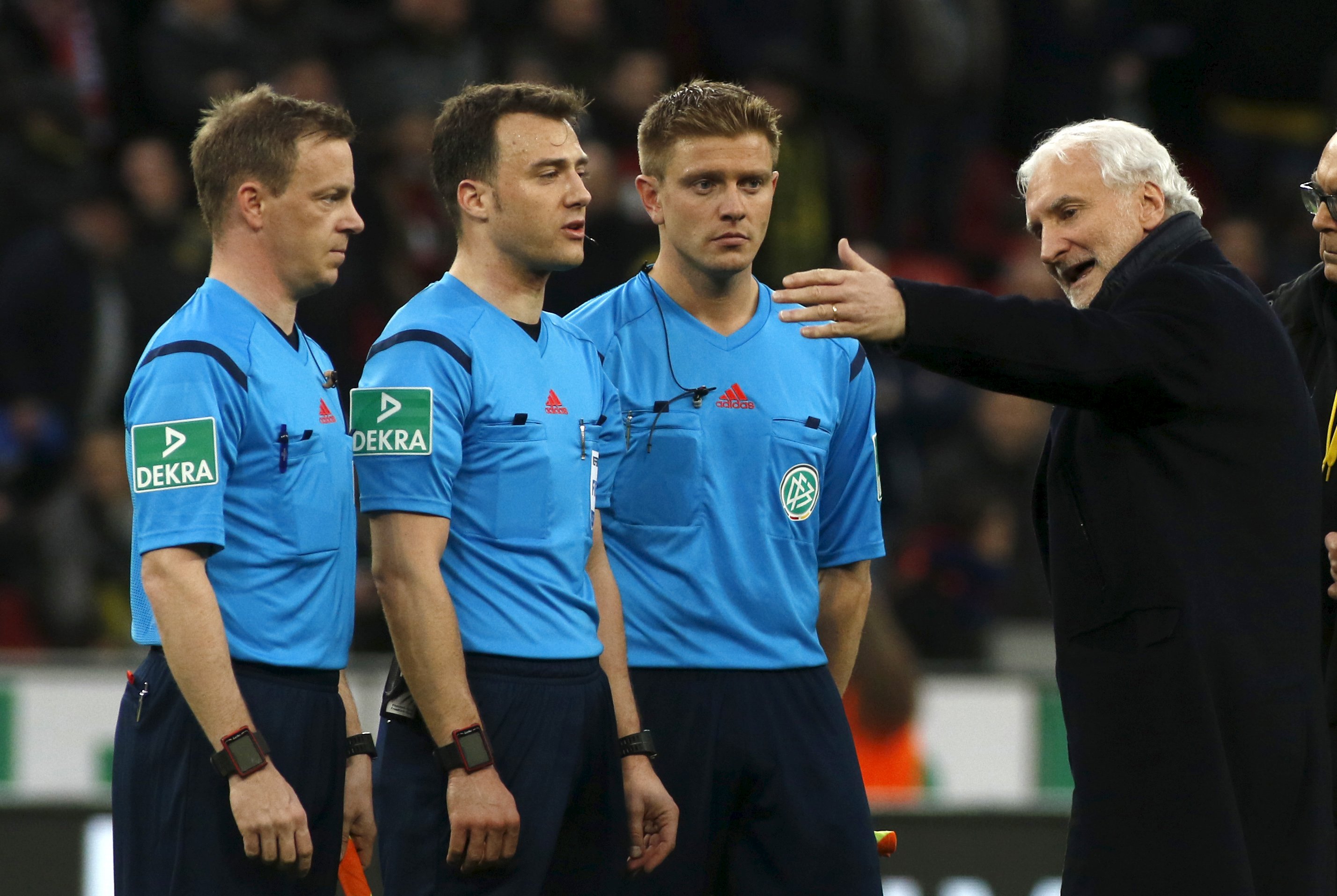 Football Soccer -- Bayer Leverkusen v Borussia Dortmund - German Bundesliga - BayArena , Leverkusen, 21/02/16 Leverkusen's sport director Rudi Voeller (R) discusses with referees after the match. REUTERS/Ina Fassbender DFL RULES TO LIMIT THE ONLINE USAGE DURING MATCH TIME TO 15 PICTURES PER GAME. IMAGE SEQUENCES TO SIMULATE VIDEO IS NOT ALLOWED AT ANY TIME. FOR FURTHER QUERIES PLEASE CONTACT DFL DIRECTLY AT + 49 69 650050