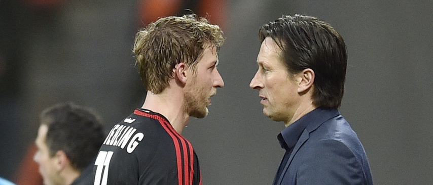 Leverkusen's Stefan Kiessling talks to Leverkusen's head coach Roger Schmidt during the German Bundesliga soccer match between Bayer Leverkusen and Borussia Dortmund in Leverkusen, Germany, Sunday, Feb. 21, 2016. (AP Photo/Martin Meissner)