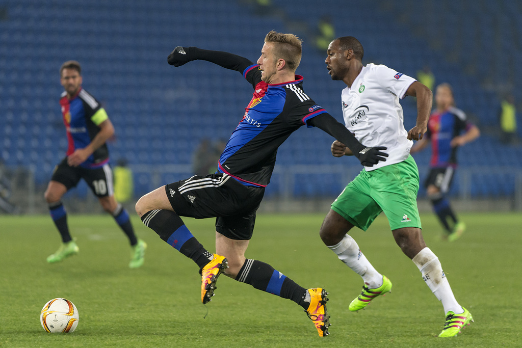 Basel's Marc Janko, left, fights for the ball against Saint-Etienne's Kevin Theophile-Catherine, right, during the UEFA Europa League Round of 32 second leg soccer match between Switzerland's FC Basel 1893 and France�s AS Saint-Etienne at the St. Jakob-Park stadium in Basel, Switzerland, on Thursday, February 25, 2016. (KEYSTONE/Georgios Kefalas)