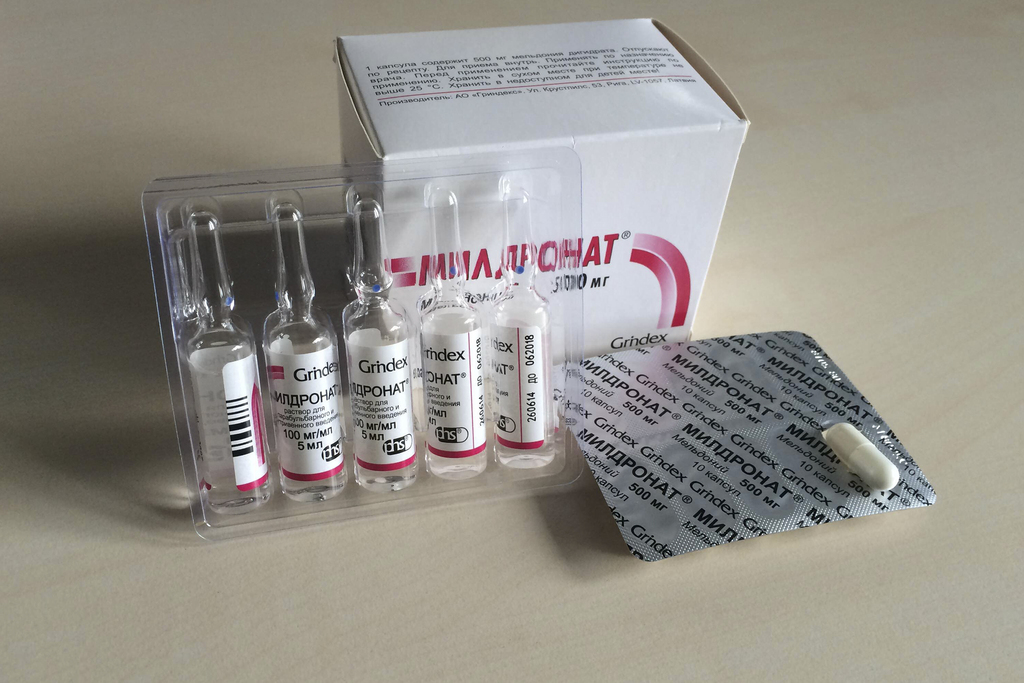 Tablets and vials of meldonium, also known as mildronate, are photographed in Moscow, Tuesday, March 8, 2016. Russian tennis star Maria Sharapova says she failed a drug test for meldonium at the Australian Open. The drug was only banned in January and there has been a string of failed tests by athletes in several sports since. (AP Photo/James Ellingworth)