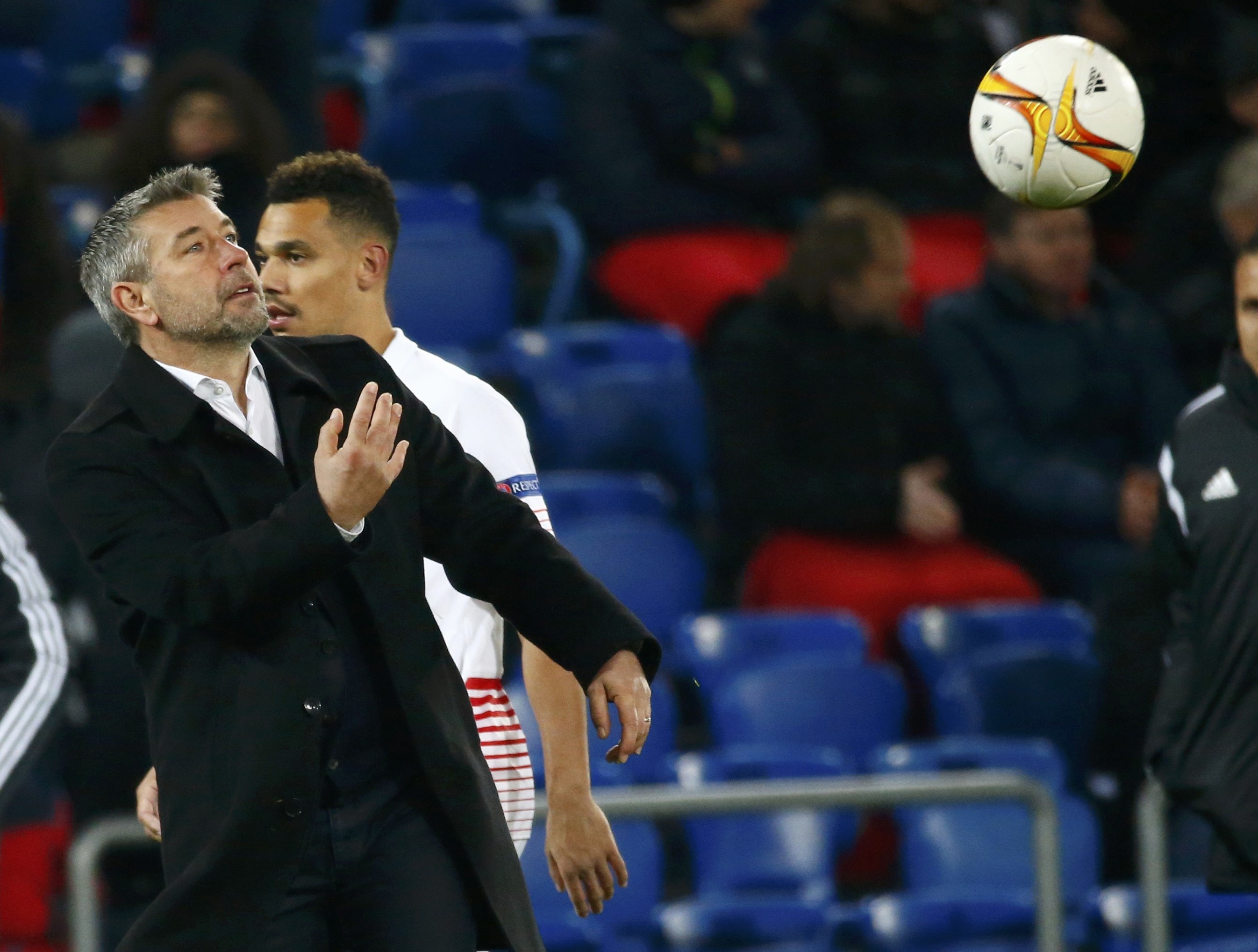 Football Soccer - Basel v Seville - UEFA Europa League R 16 - St. Jakob Park stadium, Basel, Switzerland - 10/03/2016 FC Basel's coach Urs Fischer throws the ball against FC Sevilla REUTERS/Ruben Sprich
