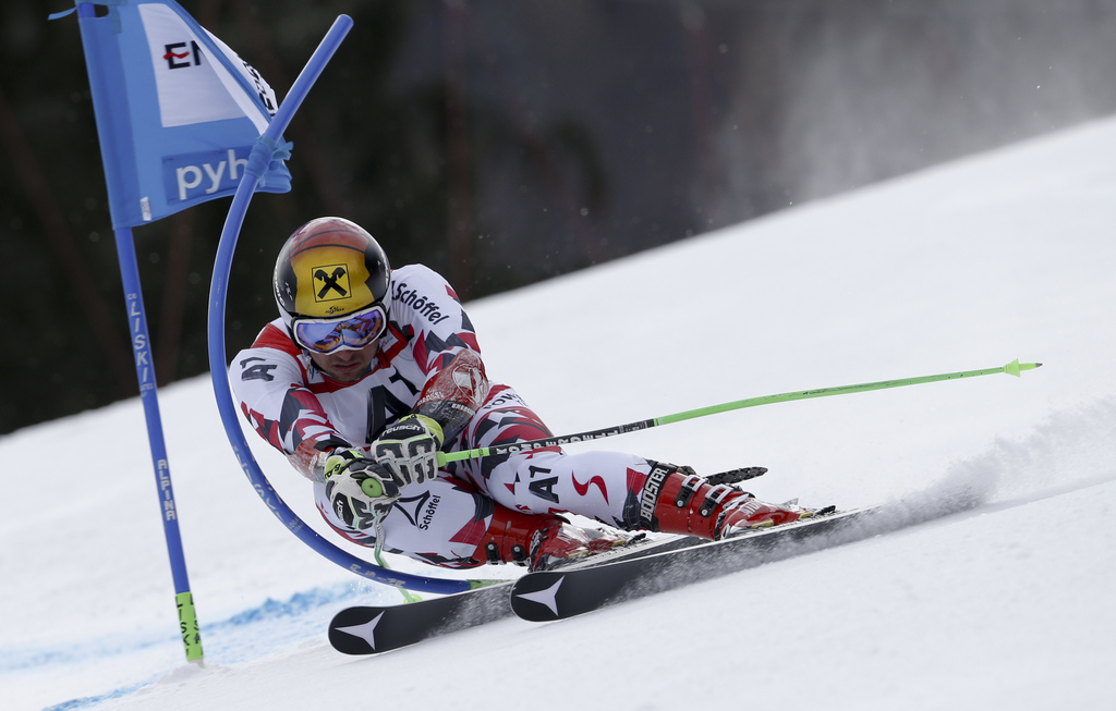Austria's Marcel Hirscher speeds down the course during the first run of an Alpine ski World Cup men's giant slalom race, in Hinterstoder, Austria, Friday, Feb. 26, 2016. (AP Photo/Alessandro Trovati)