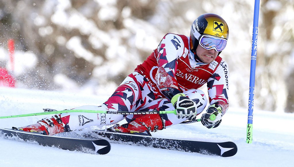 epa05193760 Marcel Hirscher of Austria clears a gate during the first run of the men's Giant Slalom race of the Alpine Skiing World Cup in Kranjska Gora, Slovenia, 04 March 2016. EPA/ANTONIO BAT
