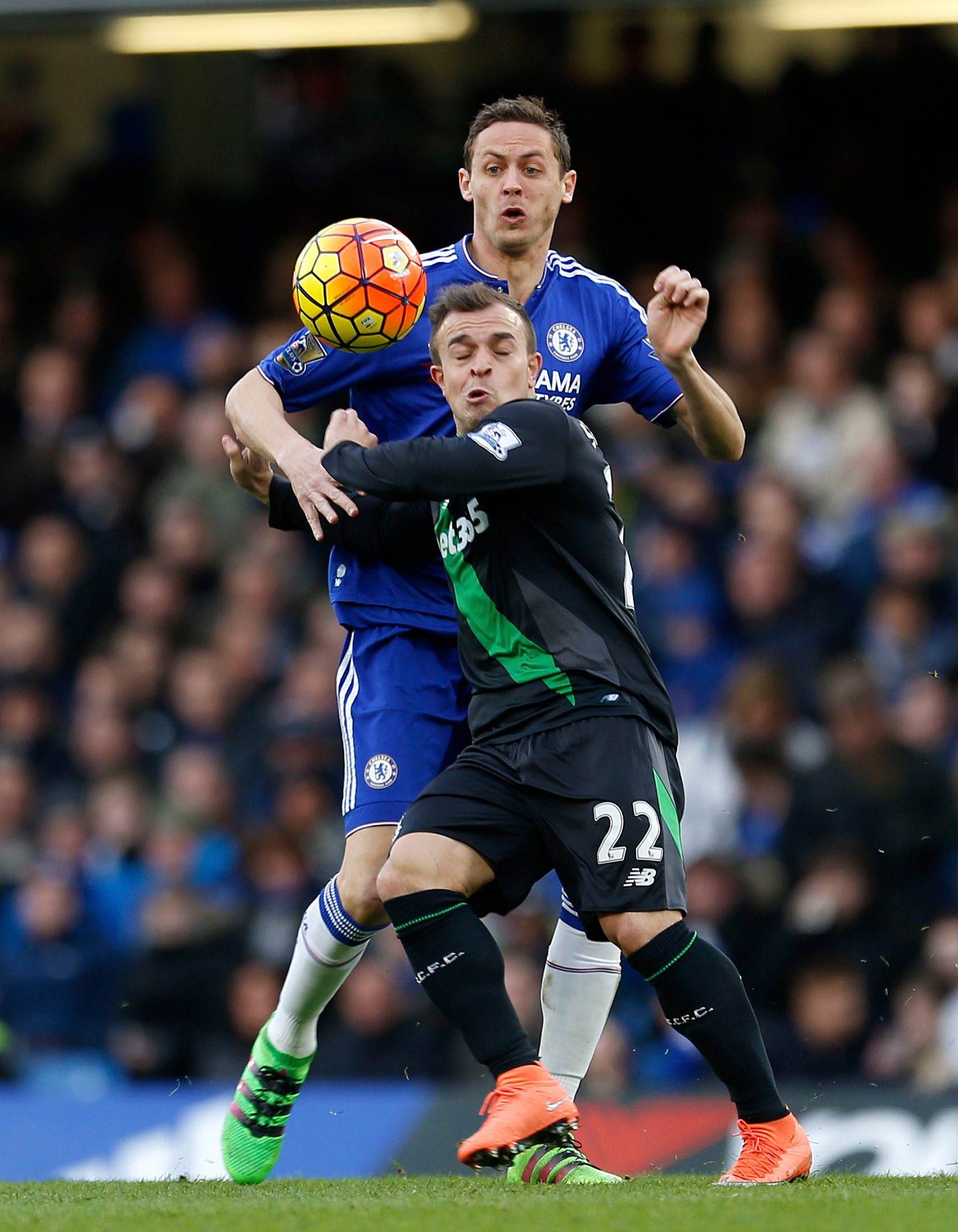 Chelsea's Nemanja Matic, left, and Stoke City's Xherdan Shaqiri battle for the ball during their English Premier League soccer match at Stamford Bridge, London, Saturday, March 5, 2016. (Steve Paston/PA via AP) UNITED KINGDOM OUT - NO SALES - NO ARCHIVES
