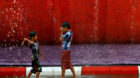 Boys play water as they celebrate Myanmar New Year Water Festival in Yangon April 12, 2016. Myanmar celebrates the New Year W