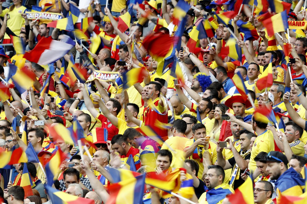 Romanian fans wave their flags and scarves prior to the Euro 2016 Group A soccer match between France and Romania, at the Stade de France, in Saint-Denis, north of Paris, Friday, June 10, 2016. (AP Photo/Frank Augstein)
