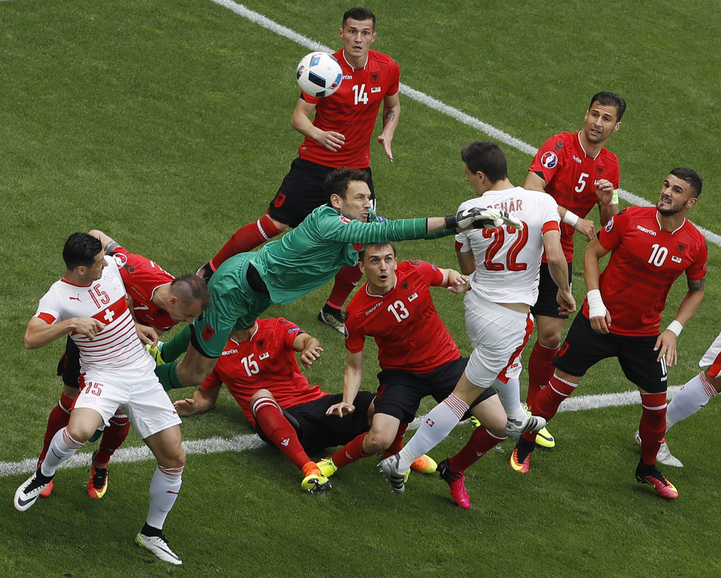 Switzerland's Fabian Schaer beats Albania goalkeeper Etrit Berisha to score a goal during the Euro 2016 Group A soccer match between Albania and Switzerland, at the Bollaert stadium in Lens, France, Saturday, June 11, 2016. (AP Photo/Darko Vojinovic)