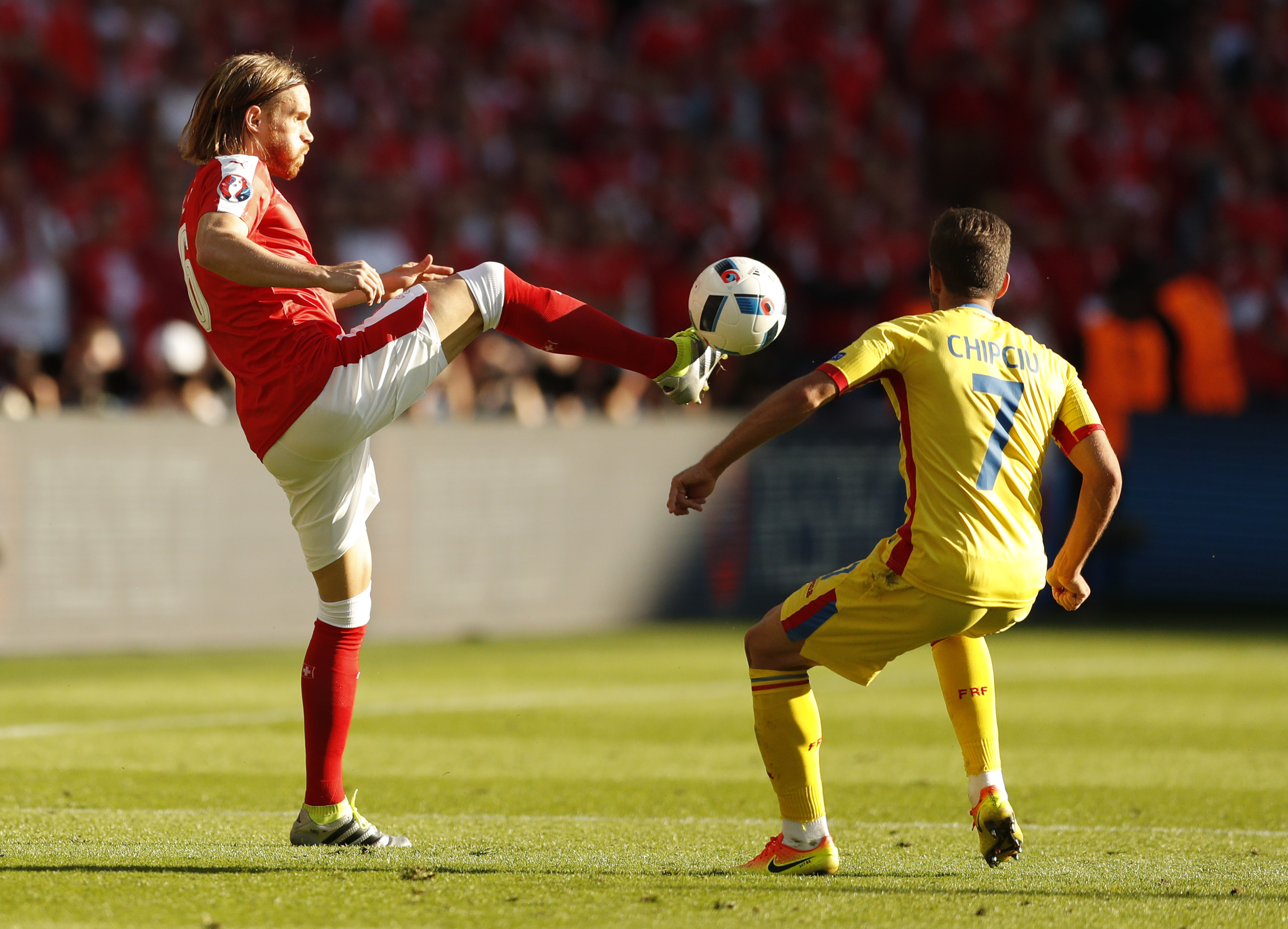 Football Soccer - Romania v Switzerland - EURO 2016 - Group A - Parc des Princes, Paris, France - 15/6/16 Switzerland's Michael Lang in action with Romania's Alexandru Chipciu REUTERS/John Sibley Livepic