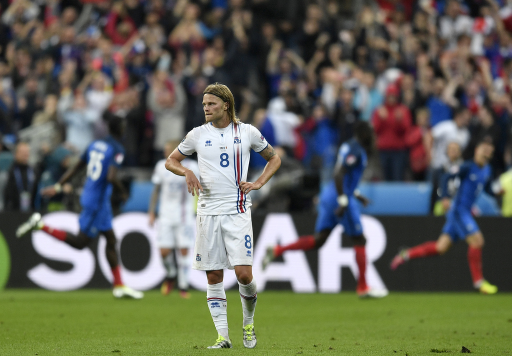 Iceland's Birkir Bjarnason reacts after France scored their third goal during the Euro 2016 quarterfinal soccer match between France and Iceland, at the Stade de France in Saint-Denis, north of Paris, France, Sunday, July 3, 2016. (AP Photo/Martin Meissner)