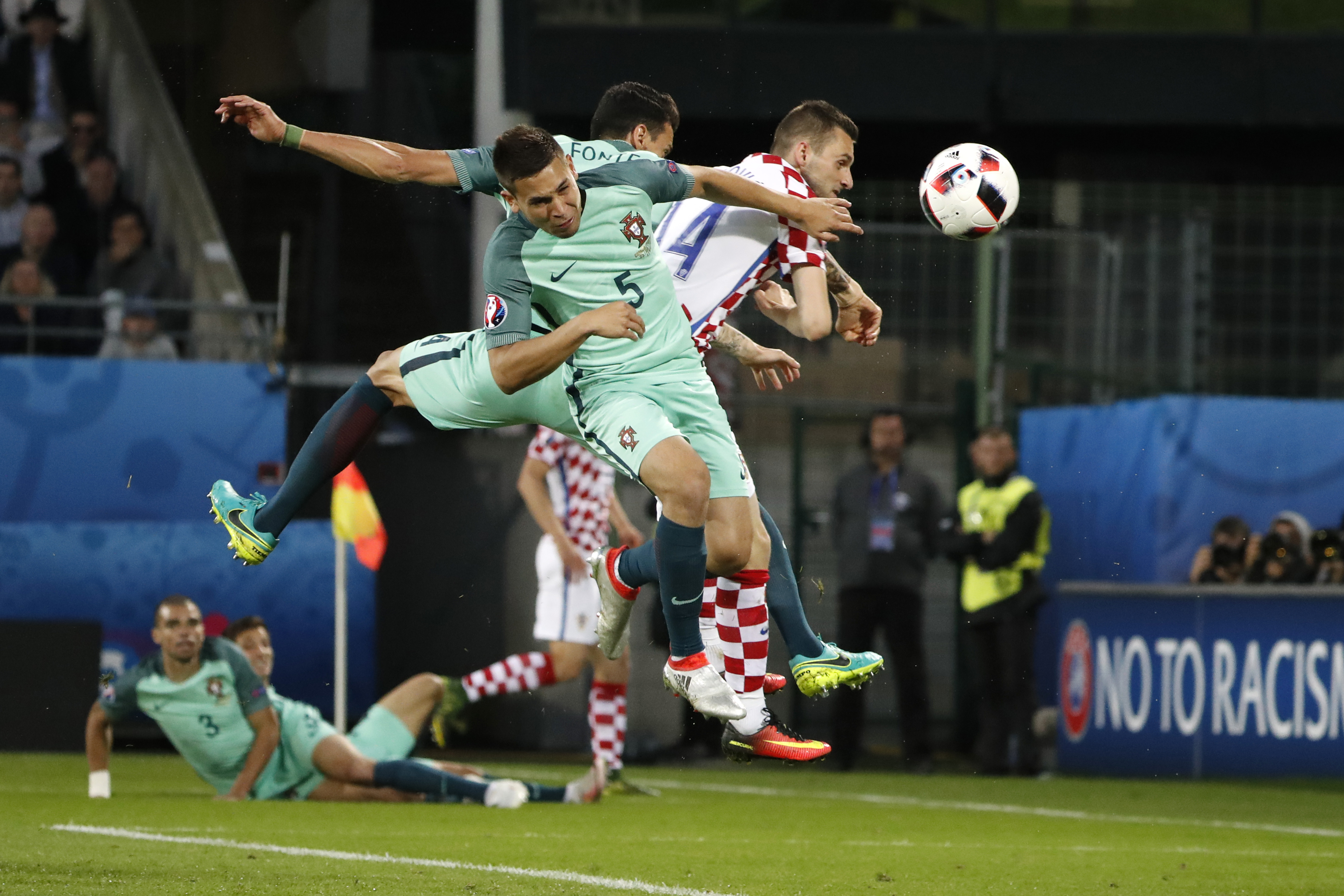 Football Soccer - Croatia v Portugal - EURO 2016 - Round of 16 - Stade Bollaert-Delelis, Lens, France - 25/6/16 Croatia's Marcelo Brozovic shoots at goal as Portugal's Raphael Guerreiro looks on REUTERS/Charles Platiau Livepic