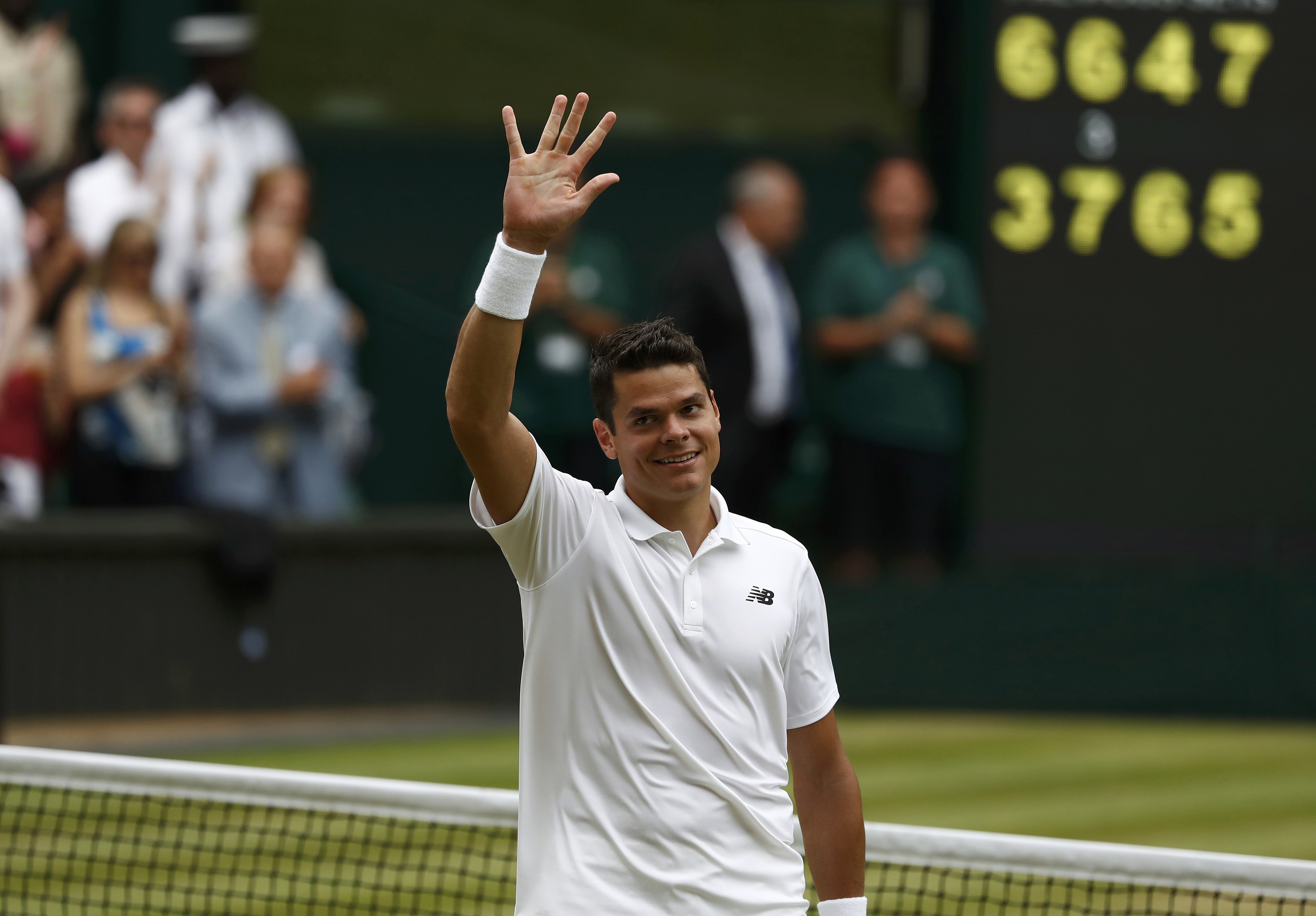 Britain Tennis - Wimbledon - All England Lawn Tennis & Croquet Club, Wimbledon, England - 8/7/16 Canada's Milos Raonic celebrates winning his match against Switzerland's Roger Federer REUTERS/Stefan Wermuth