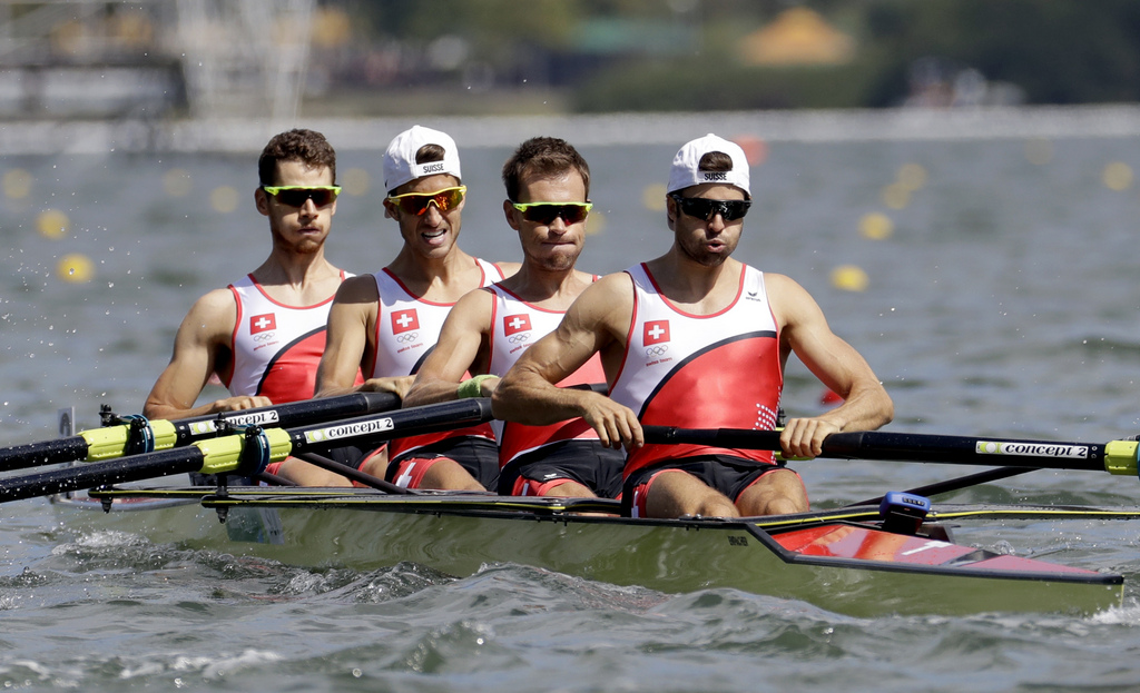 Lucas Tramer, Simon Schuerch, Simon Niepmann, and Mario Gyr, of Switzerland, row for gold in the men's rowing lightweight four final during the 2016 Summer Olympics in Rio de Janeiro, Brazil, Thursday, Aug. 11, 2016. (AP Photo/Andre Penner)