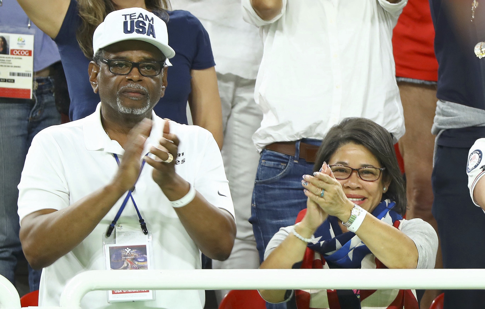 2016 Rio Olympics - Artistic Gymnastics - Victory Ceremony - Women's Vault Victory Ceremony - Rio Olympic Arena - Rio de Janeiro, Brazil - 14/08/2016. Ron and Nellie Biles clap as Simone Biles (USA) of USA receives her gold medal. REUTERS/Ruben Sprich FOR EDITORIAL USE ONLY. NOT FOR SALE FOR MARKETING OR ADVERTISING CAMPAIGNS.