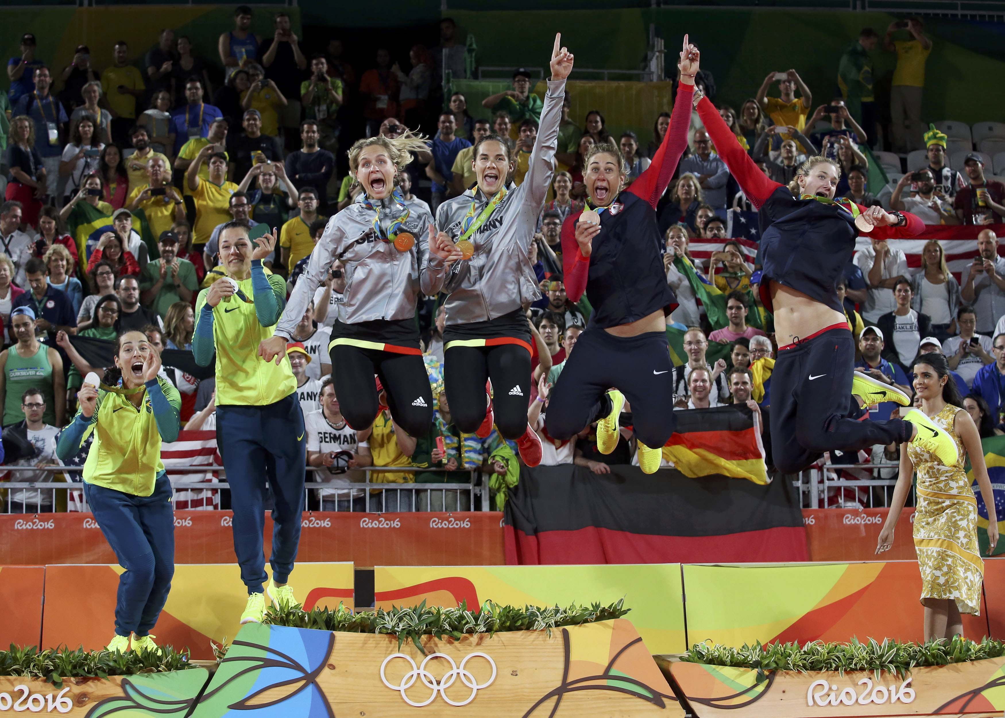 2016 Rio Olympics - Beach Volleyball - Women's Victory Ceremony - Beach Volleyball Arena - Rio de Janeiro, Brazil - 18/08/2016. Silver medalists Agatha Bednarczuk (BRA) of Brazil and Barbara Seixas Figueiredo (BRA) of Brazil, gold medalists Laura Ludwig (GER) of Germany and Kira Walkenhorst (GER) of Germany, and bronze medalists April Ross (USA) of USA and Kerri Walsh (USA) of USA celebrate. REUTERS/Adrees Latif FOR EDITORIAL USE ONLY. NOT FOR SALE FOR MARKETING OR ADVERTISING CAMPAIGNS.