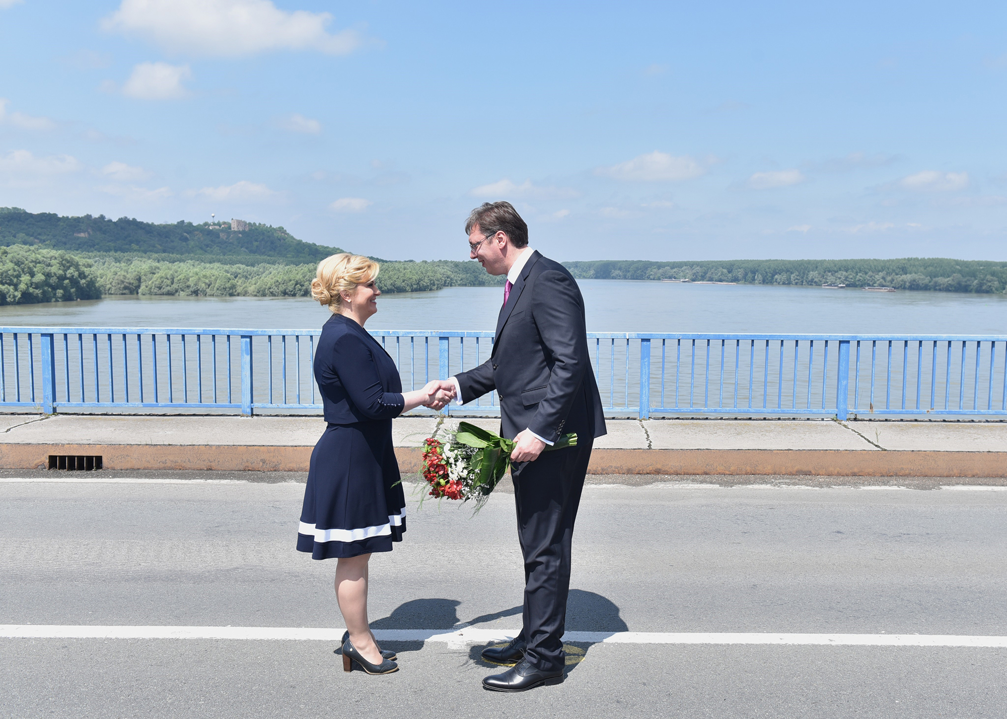 SUBOTICA, SERBIA - JUNE 20: Croatian President Kolinda Grabar-Kitarovic (L) and Serbian Prime Minister Aleksandar Vucic (R) meet at Bogojevo-Erdut border gate on June 20, 2016. (Photo by Milan Romanjuh/Anadolu Agency/Getty Images)