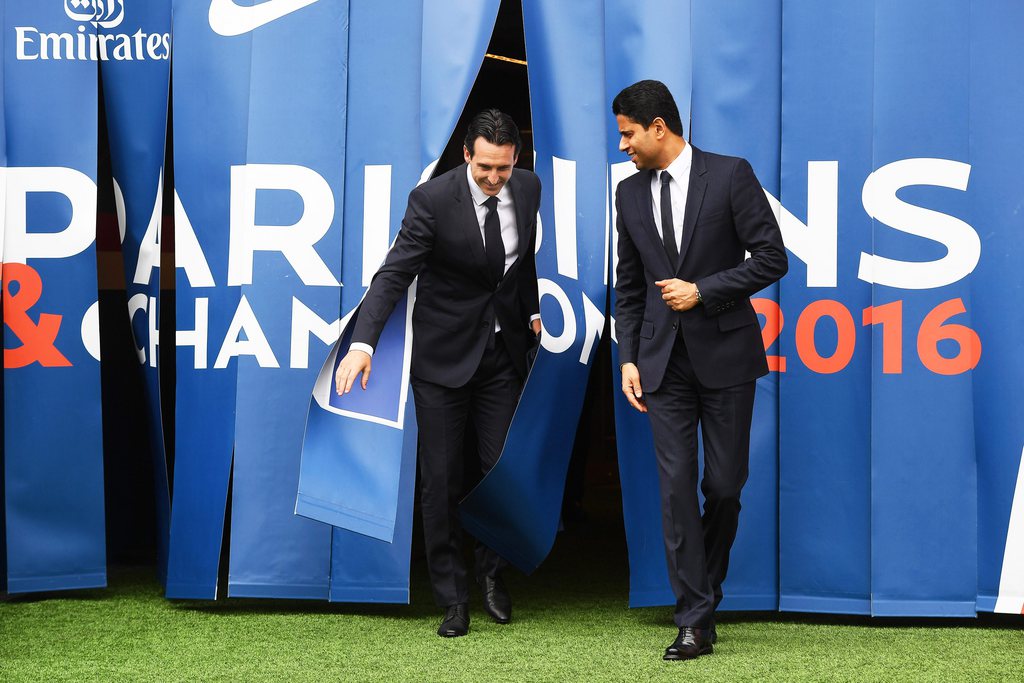 epa05407456 Spanish coach Unai Emery (L) and PSG Club owner Nasser Al-Khelaifi (R) arrive for a press conference for Emery's presentation as new head coach of Paris Saint-Germain in Paris, France, 04 July 2016. French Ligue 1 champions Paris Saint-Germain have appointed Unai Emery as new head coach to replace Laurent Blanc. EPA/CHRISTOPHE PETIT TESSON