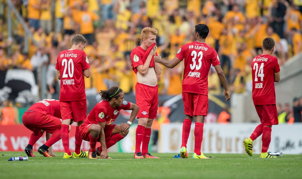 epa05502339 Leipzig's Marcel Halstenberg (l-r), Benno Schmitz, Yussuf Poulsen, Zsolt Kalmar, Marvin Compper and Dominik Kaiser on the field after losing the DFB Cup soccer match between SG Dynamo Dresden and RB Leipzig at DDV-Stadion in Dresden, Germany, 20 August 2016. Dresden won 5:4 after a penalty shootout.....(EMBARGO CONDITIONS - ATTENTION: Due to the accreditation guidlines, the DFB does NOT permit the publication and utilisation of of sequence photos on the internet and in online media during the match (including half-time.) ....(EMBARGO CONDITIONS: The DFB only permits the publication and utilisation of photos on mobile radio devices (especially MMS) and via DVB-H and DMB after the match.) EPA/THOMAS EISENHUTH