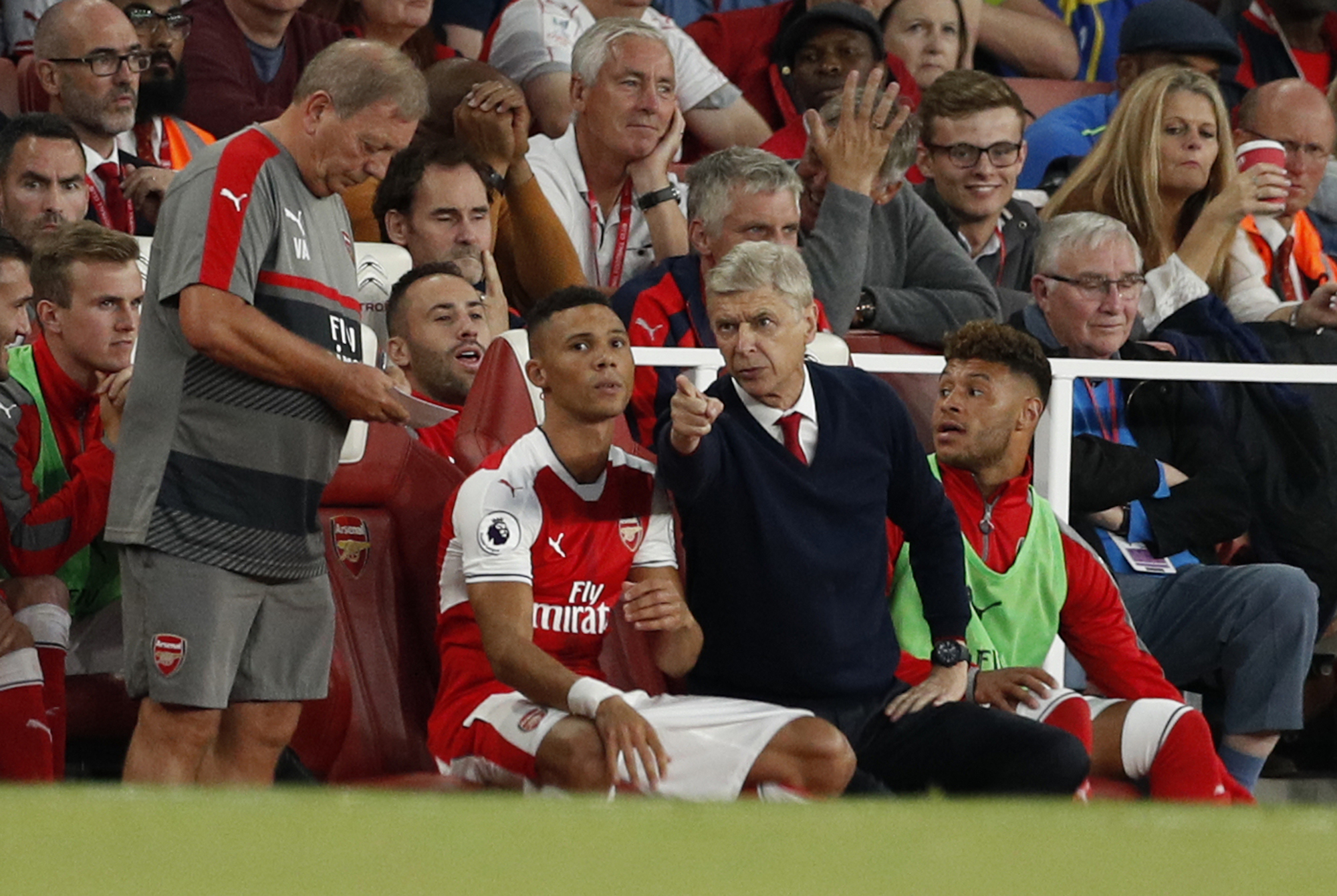 Britain Football Soccer - Arsenal v Chelsea - Premier League - Emirates Stadium - 24/9/16 Arsenal manager Arsene Wenger talks to Kieran Gibbs as he prepares to come on Action Images via Reuters / John Sibley Livepic EDITORIAL USE ONLY. No use with unauthorized audio, video, data, fixture lists, club/league logos or