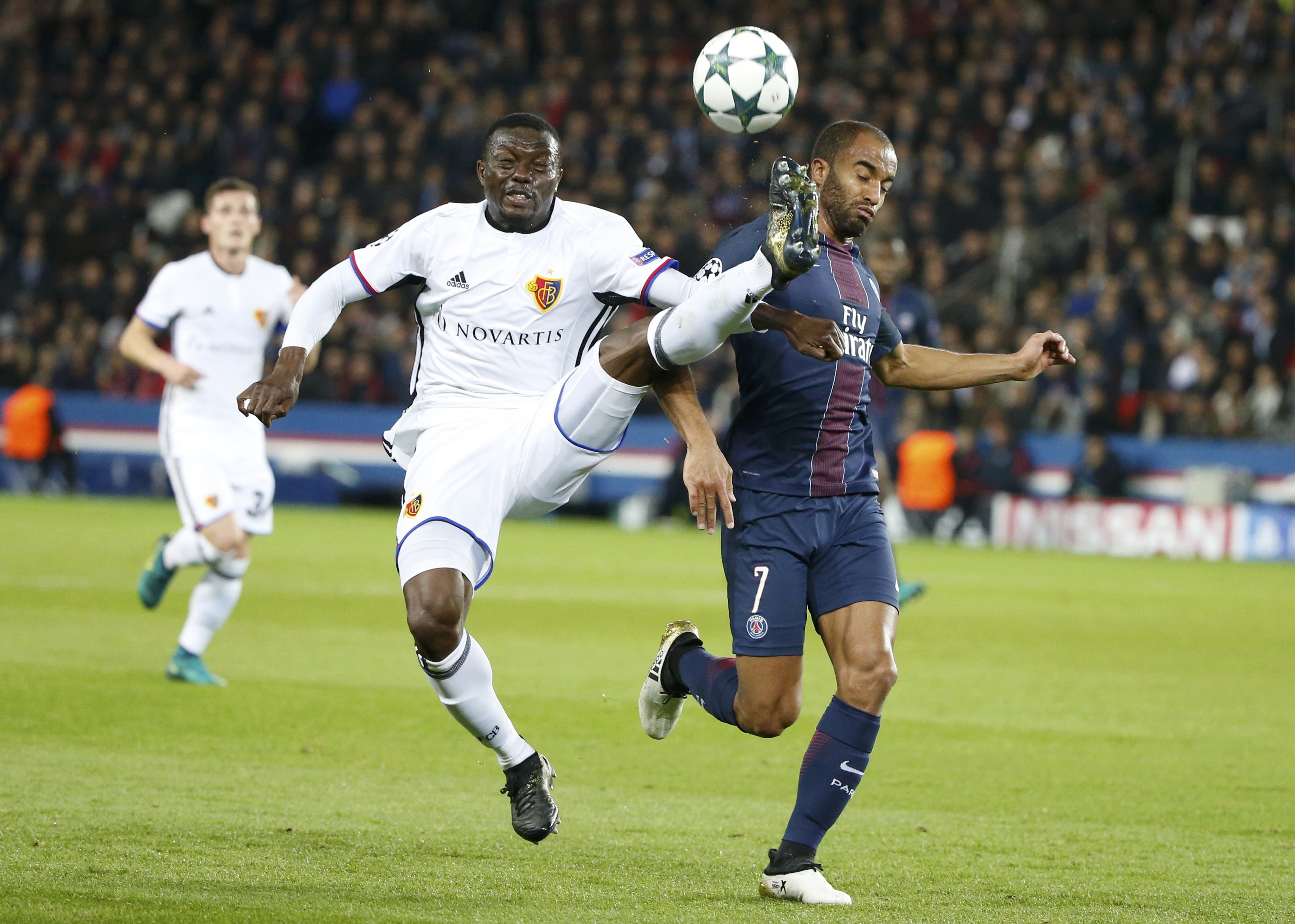 Football Soccer - Paris St Germain v FC Basel - UEFA Champions League Group Stage - Group A - Parc des Princes - Paris,France - 19/10/16 FC Basel's Adama Traore (L) in action with Paris St Germain's Lucas. REUTERS/Charles Platiau