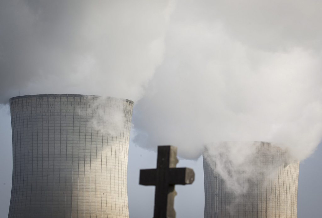 epa05209066 A general view from a cemetary of the nuclear power plant in Tihange, Belgium, 13 March 2016. Technical problems with Belgium's ageing nuclear plants have created tensions with neighbouring Germany, which is moving toward clean and sustainable energy sources and has passed legislation that requires the closure of all its commercial nuclear reactors by 2022. EPA/JULIEN WARNAND