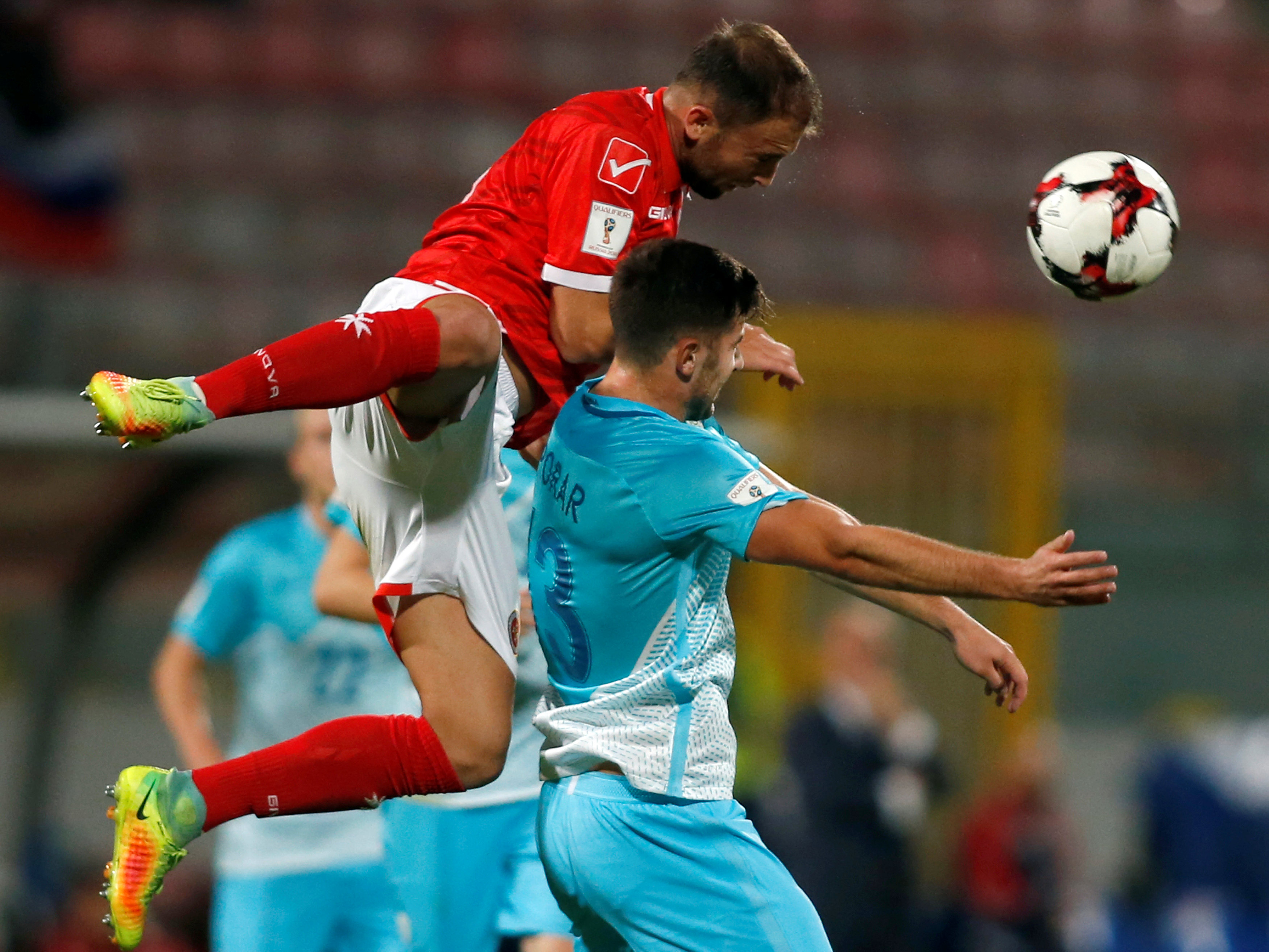 <p>Football Soccer - Malta v Slovenia - 2018 World Cup Qualifying - National Stadium in Ta' Qali, Valleta, Malta - 11/11/16. Malta's Andrei Agius fights for the ball with Slovenia's Andraz Sporar. REUTERS/Darrin Zammit Lupi MALTA OUT. NO COMMERCIAL OR EDITORIAL SALES IN MALTA</p>
