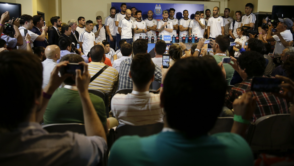Argentina's Lionel Messi, center, talks surrounded by the teammates after a 2018 Russia World Cup qualifying soccer match against Colombia in San Juan, Argentina, Wednesday, Nov. 16, 2016. Messi said players will not talk to press anymore because they consider that the press is being disrespectful. (AP Photo/Natacha Pisarenko)
