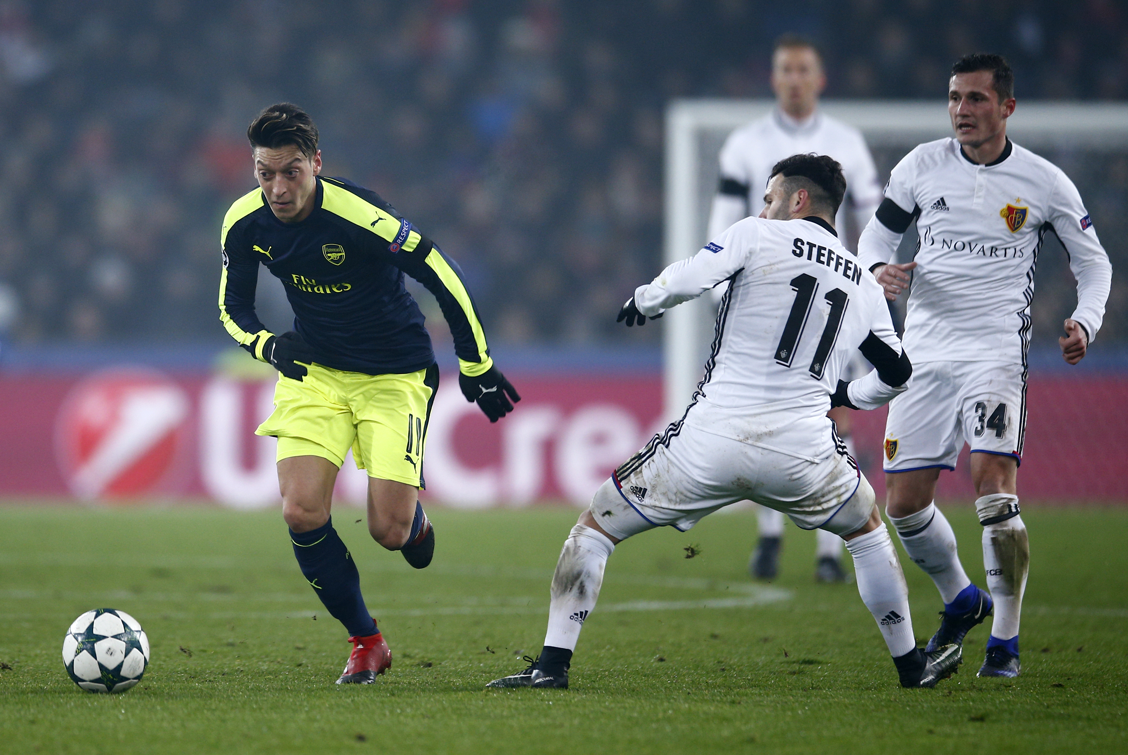 Football Soccer - FC Basel v Arsenal - UEFA Champions League Group Stage - Group A - St.Jakob-Park, Basel, Switzerland - 6/12/16 Arsenal's Mesut Ozil in action with FC Basel's Renato Steffen Action Images via Reuters / Andrew Couldridge Livepic EDITORIAL USE ONLY.