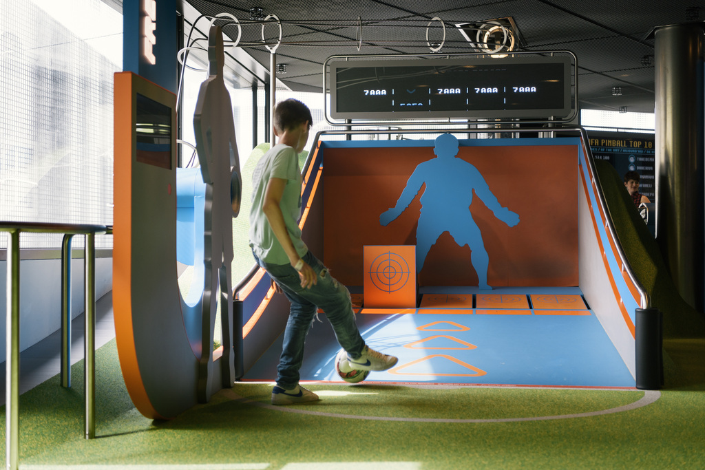 A child plays pinball football at the FIFA World Football Museum in Zurich, Switzerland, on May 17, 2016. Exhibits at the museum, which is owned and operated by FIFA, include memorabilia from every FIFA World Cup and FIFA Women's World Cup. (KEYSTONE/Christian Beutler)