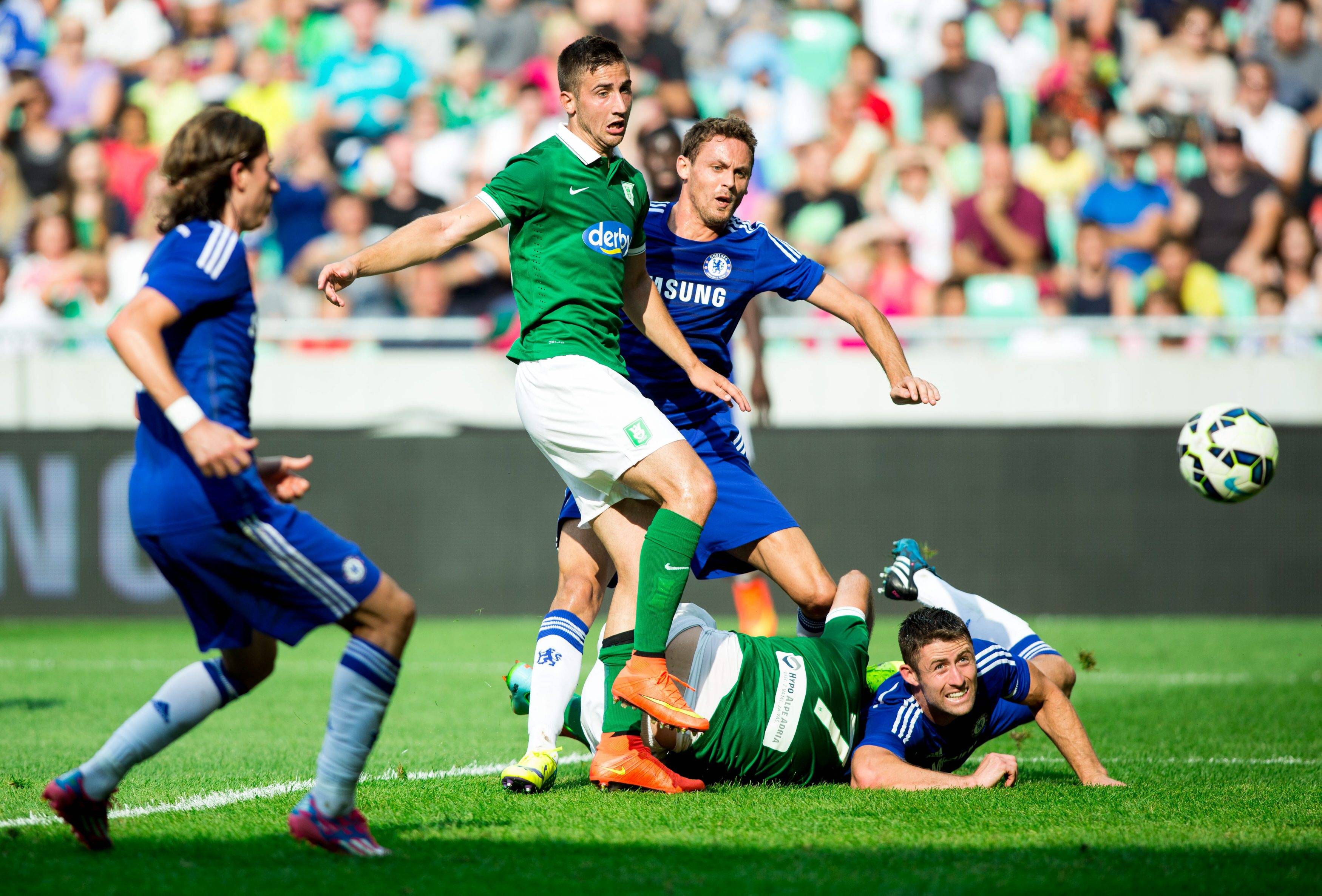28.07.2014, SRC Stozice, Ljubljana, SLO, FS Vorbereitung, NK Olimpija Ljubljana and Chelsea FC, im Bild Andraz Sporar 10 of NK Olimpija Ljubljana and Aleksandar Rodic 7 of NK Olimpija Ljubljana vs ? and Gary Cahill 24 of Chelsea FC // during international Friendly between NK Olimpija Ljubljana and Chelsea FC at the SRC Stozice in Ljubljana, Slovenia on 2014/07/27. , EP_SPO/E 28 07 2014 SRC Sto�ice Ljubljana SLO FS Preparations NK Olimpija Ljubljana and Chelsea FC in Picture Andraz Sporar 10 of NK Olimpija Ljubljana and Aleksandar Rodic 7 of NK Olimpija Ljubljana vs and Gary Cahill 24 of Chelsea FC during International Friendly between NK Olimpija Ljubljana and Chelsea FC AT The SRC Sto�ice in Ljubljana Slovenia ON 2014 07 27 E