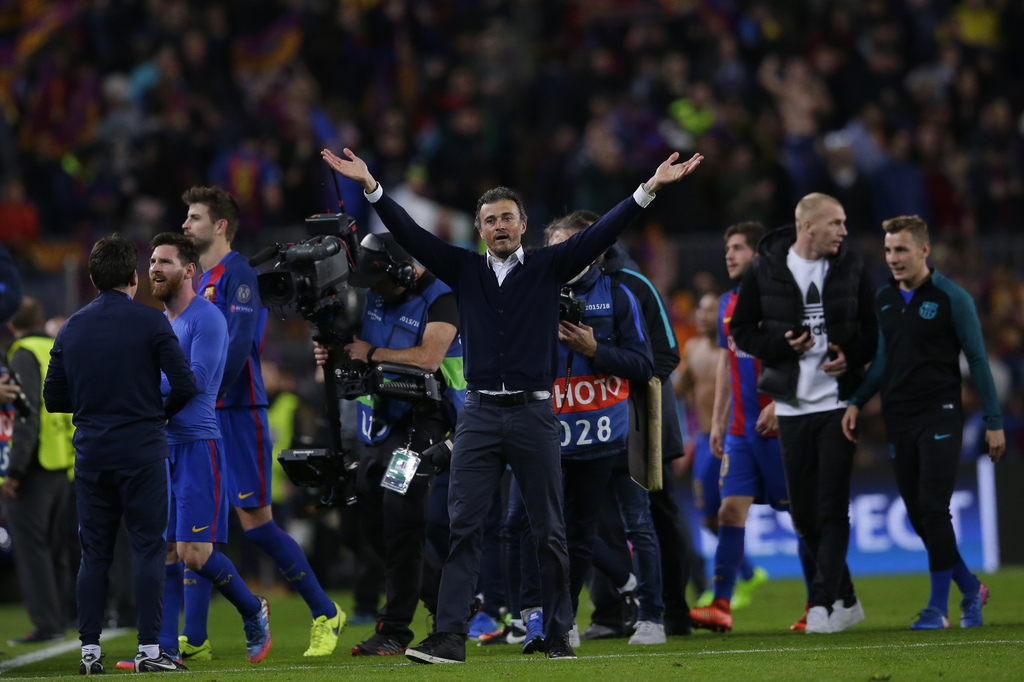 Barcelona's head coach Luis Enrique celebrates at the end of the Champions League round of 16, second leg soccer match between FC Barcelona and Paris Saint Germain at the Camp Nou stadium in Barcelona, Spain, Wednesday March 8, 2017. Barcelona won the match 6-1 (6-5 on aggregate). (AP Photo/Manu Fernandez)
