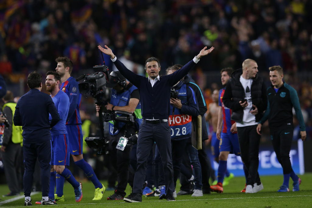 Barcelona's head coach Luis Enrique celebrates at the end of the Champions League round of 16, second leg soccer match between FC Barcelona and Paris Saint Germain at the Camp Nou stadium in Barcelona, Spain, Wednesday March 8, 2017. Barcelona won the match 6-1 (6-5 on aggregate). (AP Photo/Manu Fernandez)
