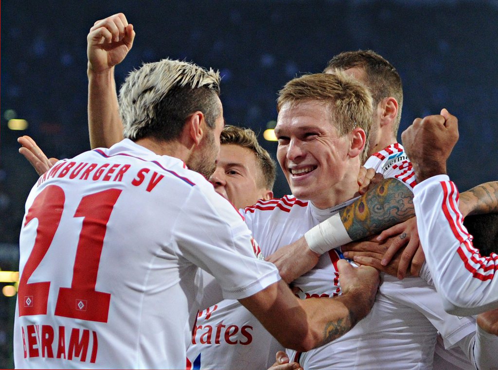epa04501295 Hamburg's Valon Behrami (L) and Artjoms Rudnevs celebrate the 1-0 goal during the German Bundesliga soccer match between Hamburger SV and Werder Bremen in the Imtech Arena in Hamburg, Germany, 23 November 2014. Hamburg wins 2-0. ..(EMBARGO CONDITIONS - ATTENTION - Due to the accreditation guidelines, the DFL only permits the publication and utilisation of up to 15 pictures per match on the internet and in online media during the match) EPA/AXEL HEIMKEN