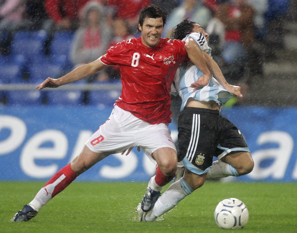 Swiss Raphael Wicky, left, fights for the ball with Argentina's Carlos Tevez, during a international friendly soccer game between Switzerland and Argentina, at St. Jakob Park Stadium in Basel, Switzerland, Saturday, June 2, 2007. (KEYSTONE/Georgios Kefala